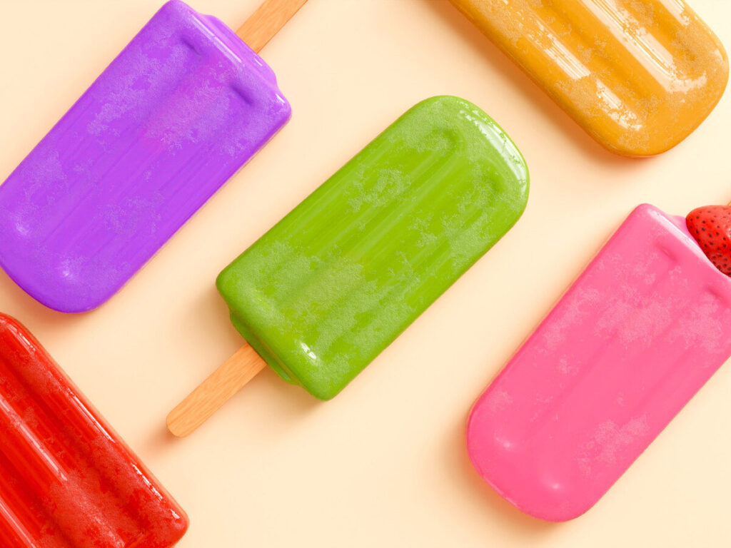 カラフルなアイスキャンディーが並んだ冷凍食品のイメージ